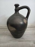 Old large black jug