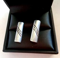 Silver modern earrings with an openwork pattern