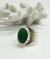 Silver ring with an emerald stone