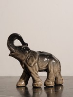 Porcelain elephant with an upward pointing trunk 9x8cm