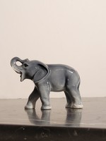 Porcelain elephant with an upward pointing trunk 8x6cm