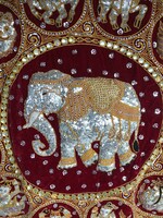 A wall hanging richly decorated with Indian elephants and constellations