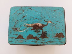 Old metal box with bird pattern