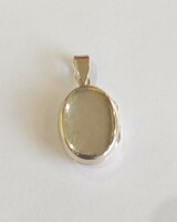 New, silver, openable photo holder pendant, with a shiny surface. 4.63G. (E. 12.)