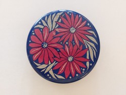 Old metal box with round floral design