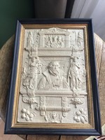A framed picture made of older special cast material, with the stamp of the wagnermuseum