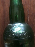 Green glass bottle embossed with the inscription Graham. In undamaged condition. 30X7 cm.