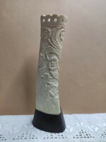 Peasant flute player with flowers and life portrait made of gray cattle leg bone is a special decorative item