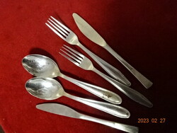Chrome cutlery, two forks, two spoons, two knives. Not the same brand. Jokai.