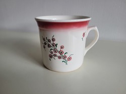 Old large 1-liter granite-tipped folk mug with sour cream and sleeping milk with a floral pattern
