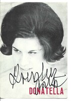 Donatella Moretti olasz énekesnő autográf, dedikált, sajátkezű aláírása fotólapon.