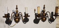 In a pair of wall arms, a Flemish-style candle holder type candle works with a light bulb.