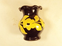 Old retro ceramic vase painted with a flower pattern