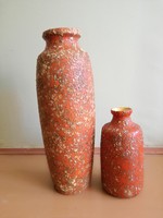 2 pond head vases together
