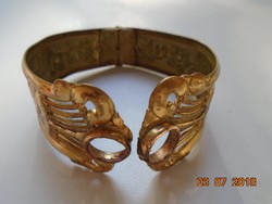 Antique fire-gilded repoussé wide bangle with delicate openwork and convex pattern