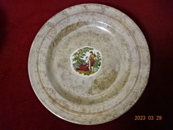 Ukrainian porcelain plate with a picture depicting a scene in the middle. Jokai.