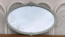 Large oval mirror, with carvings, can be used lying down or standing up,