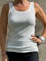 Sleeveless white casual top with a glittery pattern and a lace insert on the back