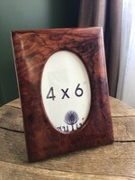 A special tabletop photo frame, perhaps made of olive wood