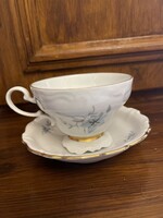 Matching teacup with small saucer.