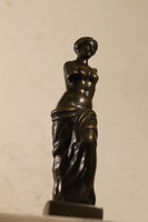 Antique bronze statue on a marble base 938