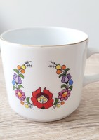 Hand-painted in Kalocsai - on a mug manufactured by the Great Plains