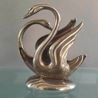 Pair of swans holding a metal napkin