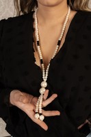 Elegant, long pearl necklaces are beautiful.