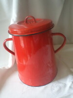 Old, enamelled, red-colored greasy barrel
