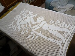 White crochet lace angel curtain.