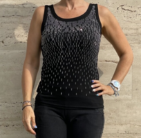 Sleeveless black casual top with glitter pattern and lace insert on the back
