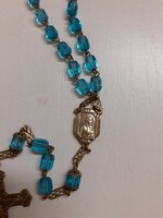Rosary prayer chain made of old polished blue crystal beads with a sophisticated crucifix on it