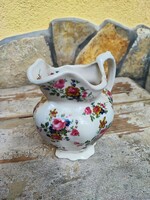 Staffordshire small jug with floral pattern.