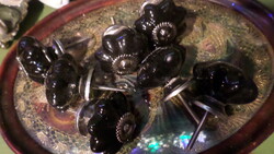 7 pieces of black, ceramic furniture knobs / drawer pulls in one. It was never used.