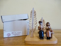 Pair of folk art, woodwork dregeno figurines in original box