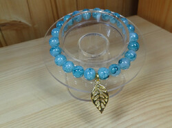 Jade mineral turquoise, marble-colored bracelet with beautiful pale gold-colored leaf decoration.