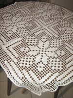 Beautiful antique hand-crocheted white tablecloth with a special pattern