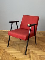 Retro design iron structure arm with red textile and black leather covering with upholstery work