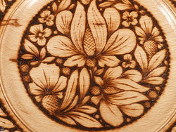 Wooden bowl with burnt decoration