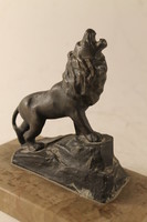 Antique bronze lion on a marble base 334