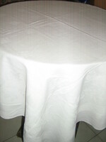 White antique damask tablecloth with a beautiful flower pattern