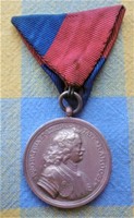 Highland war medal with matching original war ribbon t1