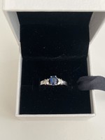White gold brilliant ring with sapphire and diamond stones