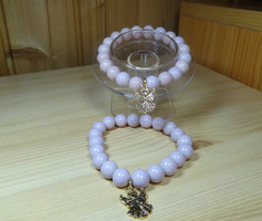 A bracelet made of beautiful, shiny powder-colored glass beads with solid decoration