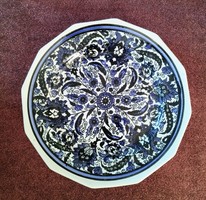 Hand-painted porcelain decorative plate with a blue pattern