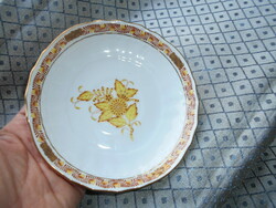 A plate with an Appony pattern - served from its rare orange size on the bottom of a tea cup