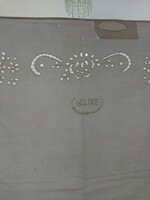 Old, repaired large white lace pillowcase with the inscription gizike 90 x 73 cm