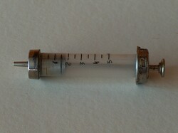 Old glass-metal syringe, used, good condition