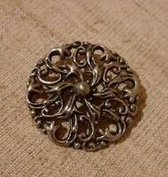 Old retro silver-colored openwork pattern ornament button in good condition