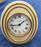 Cartier watch, alarm clock.